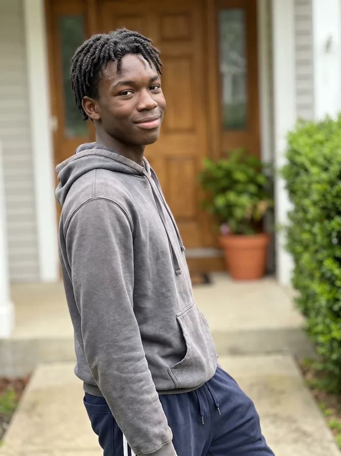 One of the phone photos a parent sent: a fictional basketball player outside the front door at home in a hoodie; photo generated
