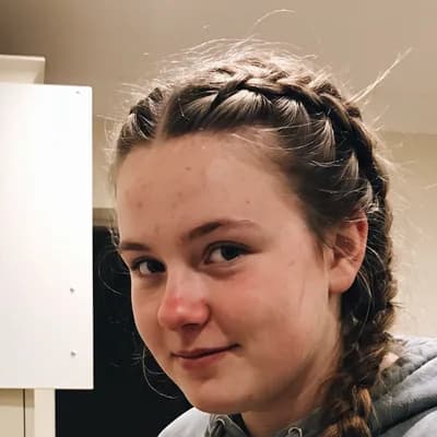 Example of a photo to send: a close-up of a fictional softball player at home, face sharp and both eyes visible — generated example photo